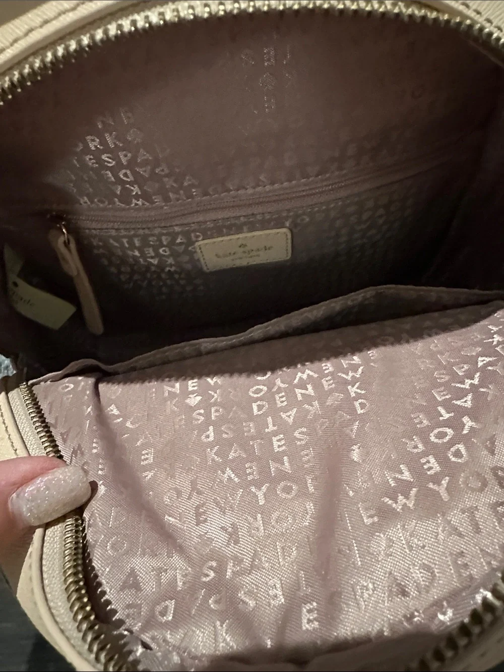 kate spade beige backpack with colorful cactus, chili and floral appliqués